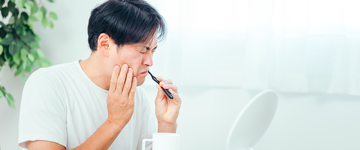 歯周病が痛い　男性